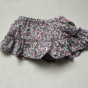 Two babyGAP skirts - Floral Ruffle skorts and black knit skirt